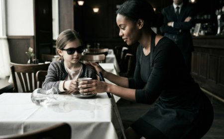 "Where's my mom?" the blind girl asked, her small hand missing the spilled water by inches. The waitress knelt down anyway, offering hot chocolate and a gentle secret. She didn't know she was being watched by a billionaire CEO—or that her simple kindness was about to expose a 5-year-old secret and change everything.