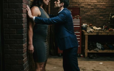 "I'm too rough, too ugly, and too damn big for you," she said, backed against the brick wall of the garage, bleeding from her arm. She expected him to finally look away in disgust — the way every other man always did. But Roman Gallagher didn't step back. He stepped closer, pinned her heavy frame against the wall with his chest, looked up at her with eyes burning like wet slate, and whispered two words that shattered every insecurity she'd ever carried. Then he kissed her like she was the only weapon he'd ever need — and the underworld would never be the same.