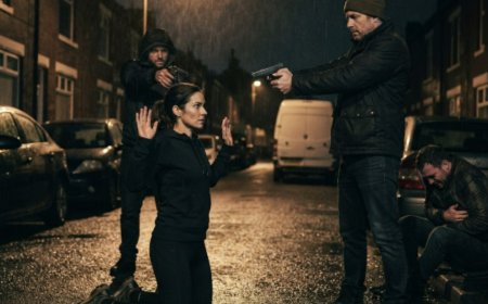 "A gun pressed to her skull, three armed men smiling on a quiet American street. They thought she was an easy target, just a woman in workout clothes with nowhere to go. She didn't scream or run. The lead man slid a Manila envelope from his jacket, but when she refused to cooperate, he drew his handgun. That was the moment everything changed. What happened next no one saw coming, and the woman they thought was prey turned the tables in a way that would shock them all.