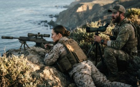 "Phantom," the SEAL commander whispered when he finally saw her service record. For two years he'd been trying to find the Marine sniper who saved his entire platoon from 3,000 meters away. She was standing right there in his assessment program the whole time — and nobody knew. Then the coastal exercise began. And when three hostile snipers locked onto her position from 1,300 meters, she didn't retreat. She didn't call for support. She fired three rounds in ninety seconds — and the legend finally had a face.