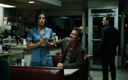 "Still lukewarm," the drunk said, and threw his ice water directly into the waitress's face right there in booth 9. She didn't scream, she just stood there blinking, one hand gripping her order pad until her knuckles went white — and then a quiet man from the corner booth stood up and locked the diner doors. The drunk laughed until he saw the cars pulling into the parking lot, and realized he had made a very dangerous mistake about who was actually in charge.
